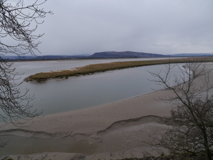 The Bela flows into the Kent Estuary with Whitbarrow in the distance