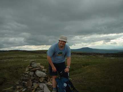 Matt by the summit cairn on Great Coum