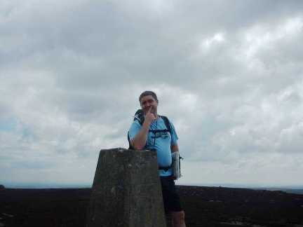 Matt by the trig point on Simon's Seat