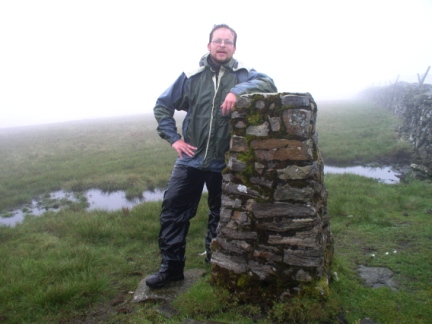 Looking very soggy by the trig point on Knoutberry Haw