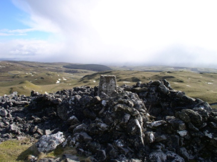 The trig point and shelter cairn on Warrendale Knotts