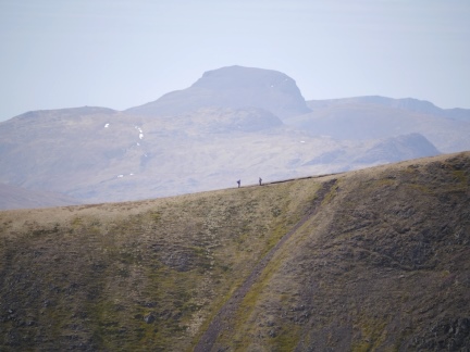 Two walkers on the Great Rigg to Fairfield ridge with Great Gable behind