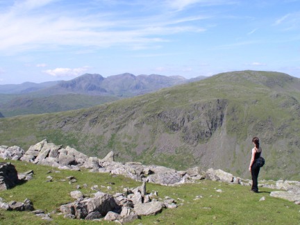 Lisa looking past Grey Friar towards the Scafells