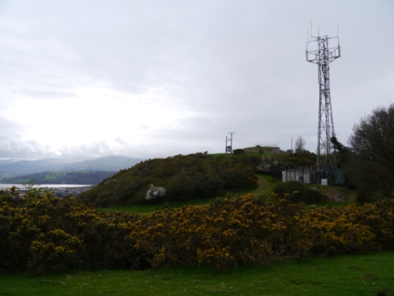 The mast and covered reservoir on the top of Bryn Pydew