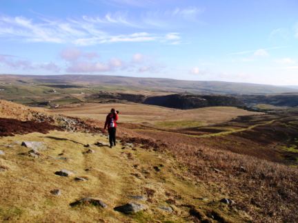 Lisa climbing Cronkley Fell