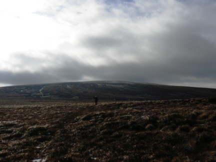 Matt approaching Bruthwaite Currick with Cold Fell behind
