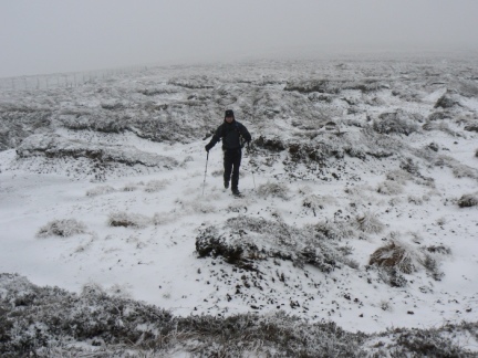 Matt negotiating the frozen peat hags on the way to Black Fell