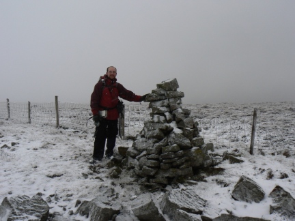 By the summit cairn on Benty Hill
