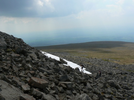 Matt climbing up a patch of snow