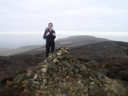 Lisa by one of the cairns on Cold Moor