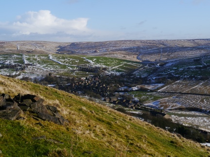 The village of Denshaw huddled beneath the hills
